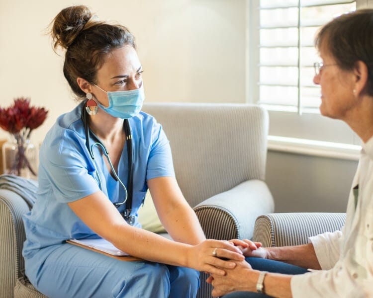 Nurse Holding A Patient's Hand