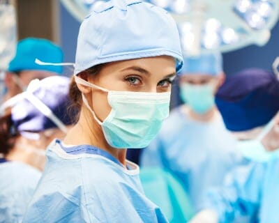 operating surgeon wearing face mask